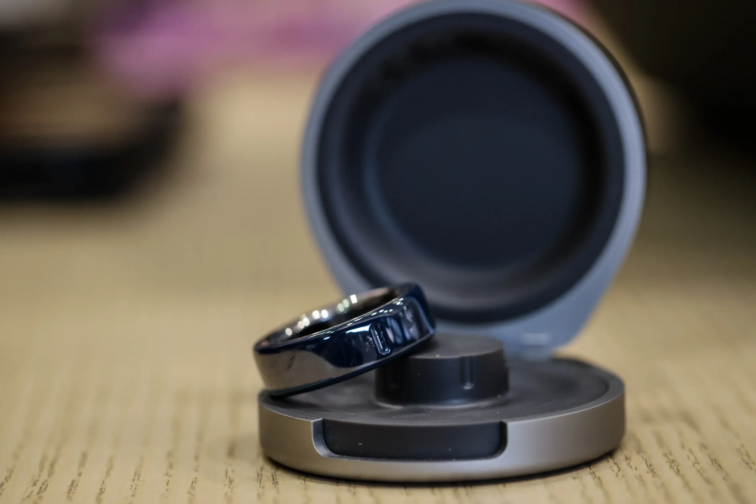 An Oura smart ring and charging case at MWC